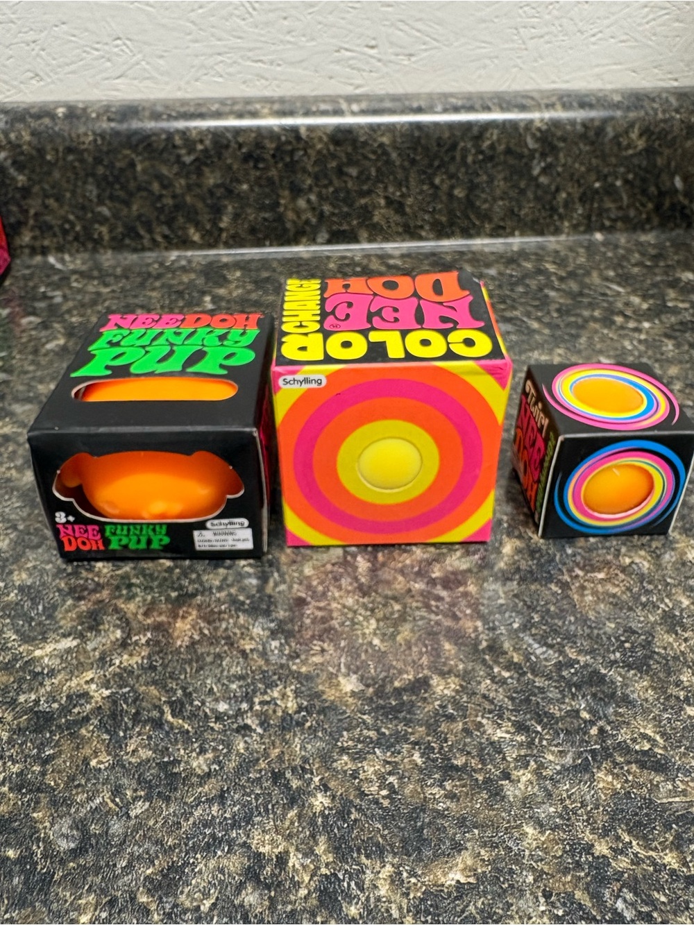 NeeDoh Orange/Yellow Bundle. Funky Pup , Color Change, and Mini Twirl